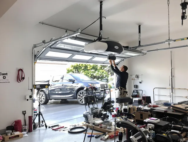 Central Falls Garage Door Repair specialist installing smart garage door opener system in Central Falls home