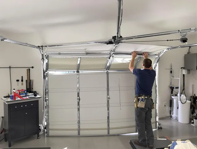 Central Falls Garage Door Repair specialist performing precise section replacement on Central Falls garage door
