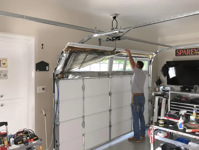 Garage door section replacement by Central Falls Garage Door Repair in Central Falls