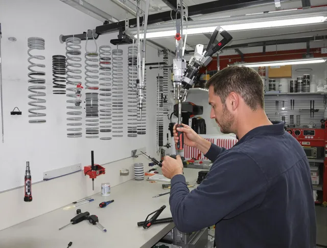 Central Falls Garage Door Repair safety certified technician performing precision spring replacement in Central Falls