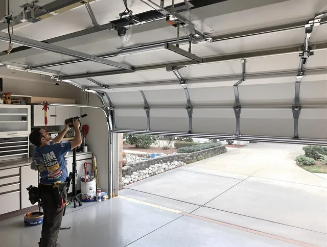 Garage door track repair service by Central Falls Garage Door Repair in Central Falls